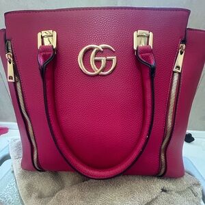 Pink Gucci Pocket Book with matching wallet.